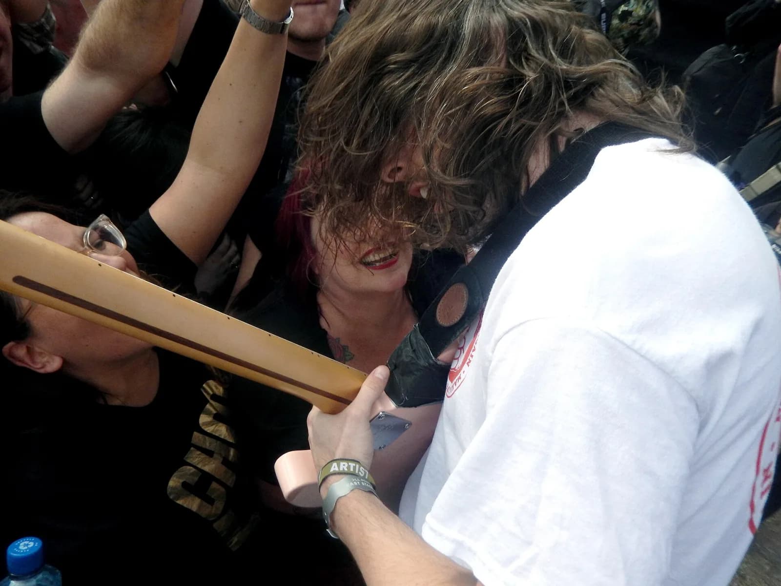 An IDLES guitarist playing in the middle of the All Points East crowd, guitar over fans