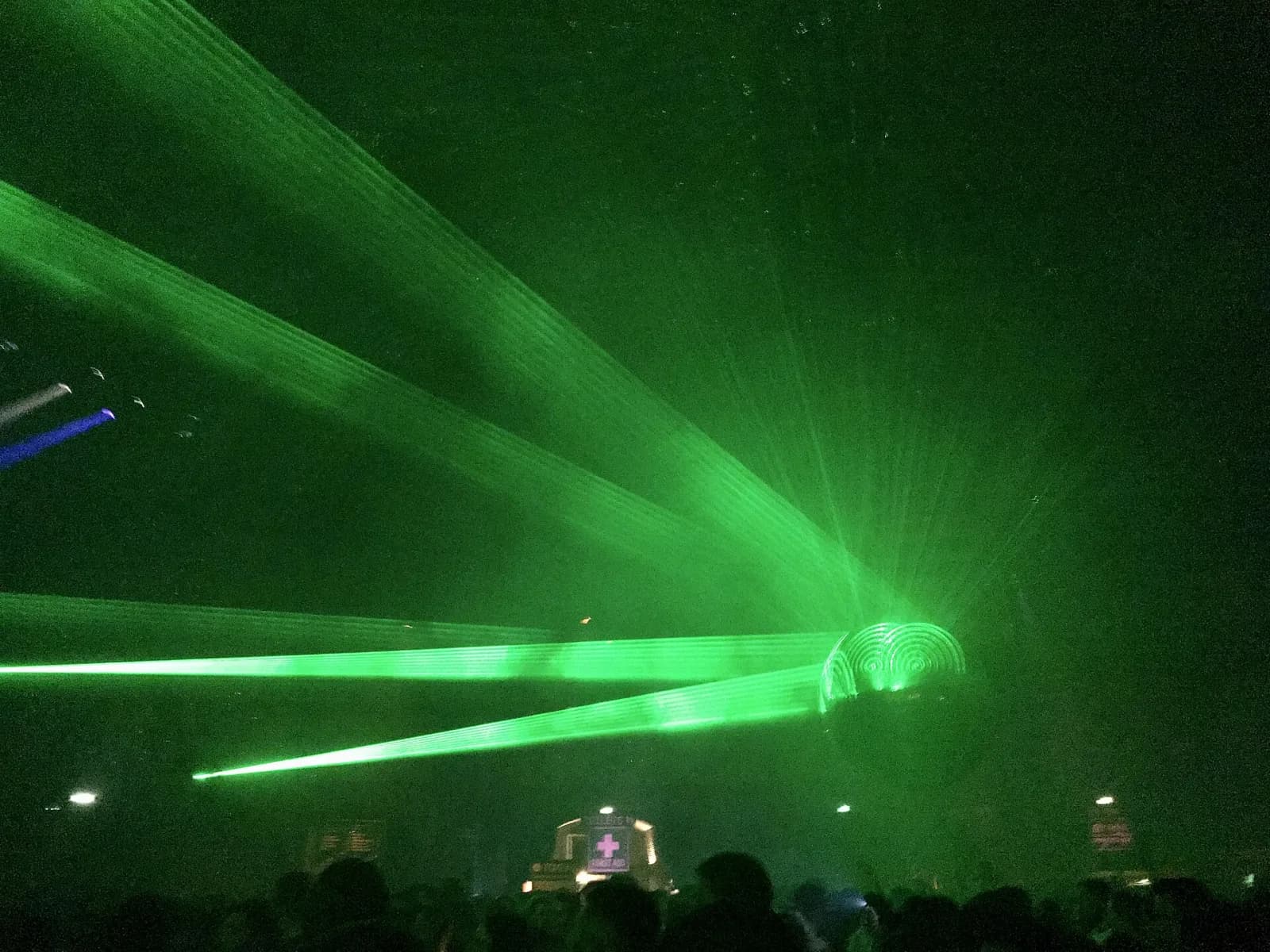 Green lasers cutting through haze over the crowd at an Awakenings Gashouder show