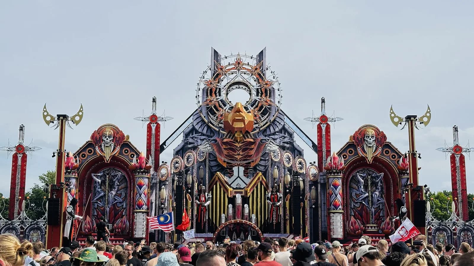 The RED mainstage at Defqon.1 2025, a towering golden-masked cathedral of speakers above the crowd