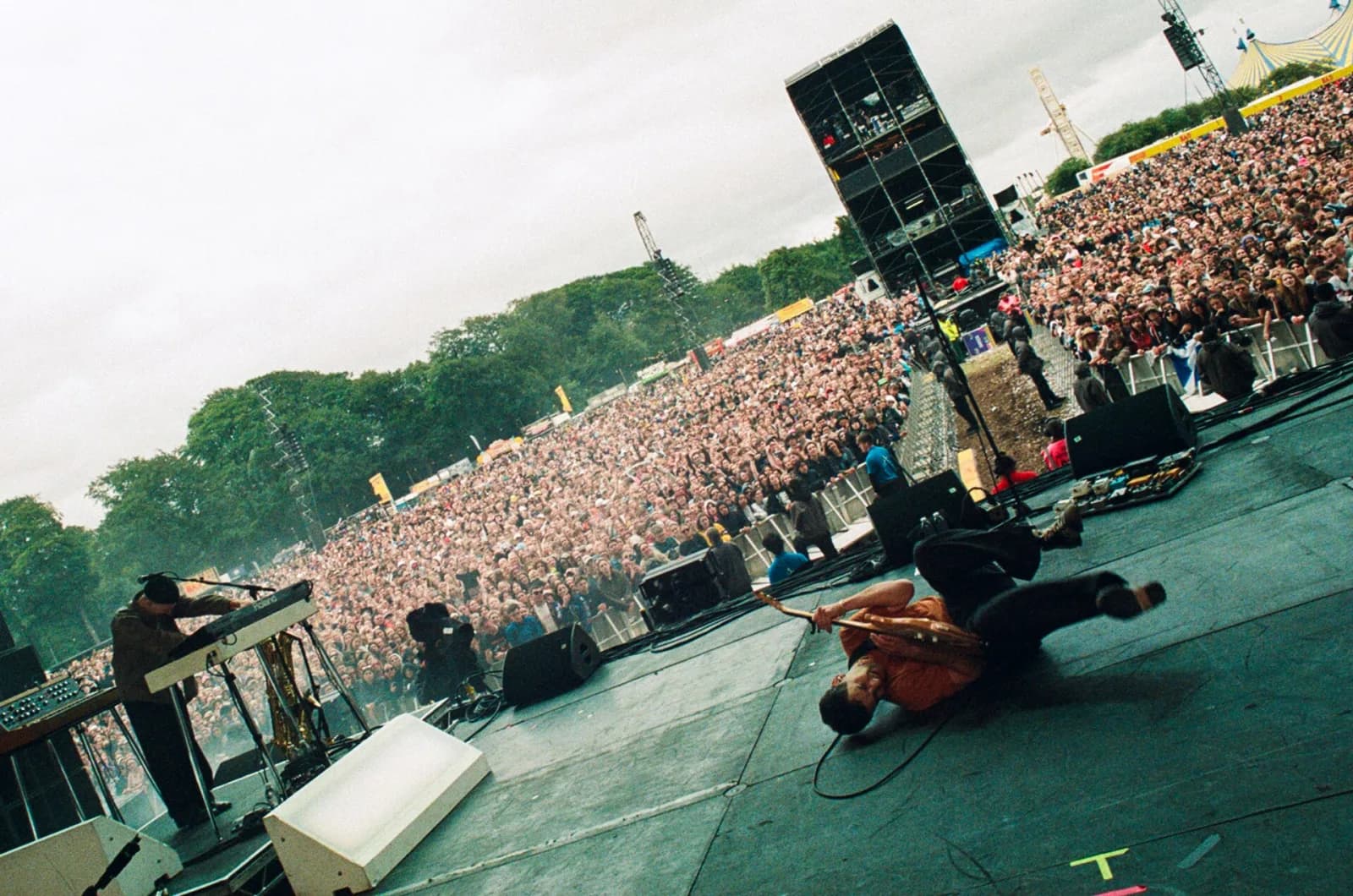 View from the main stage at Leeds Festival 2024 as Bleachers perform, with a huge crowd stretching back to the treeline