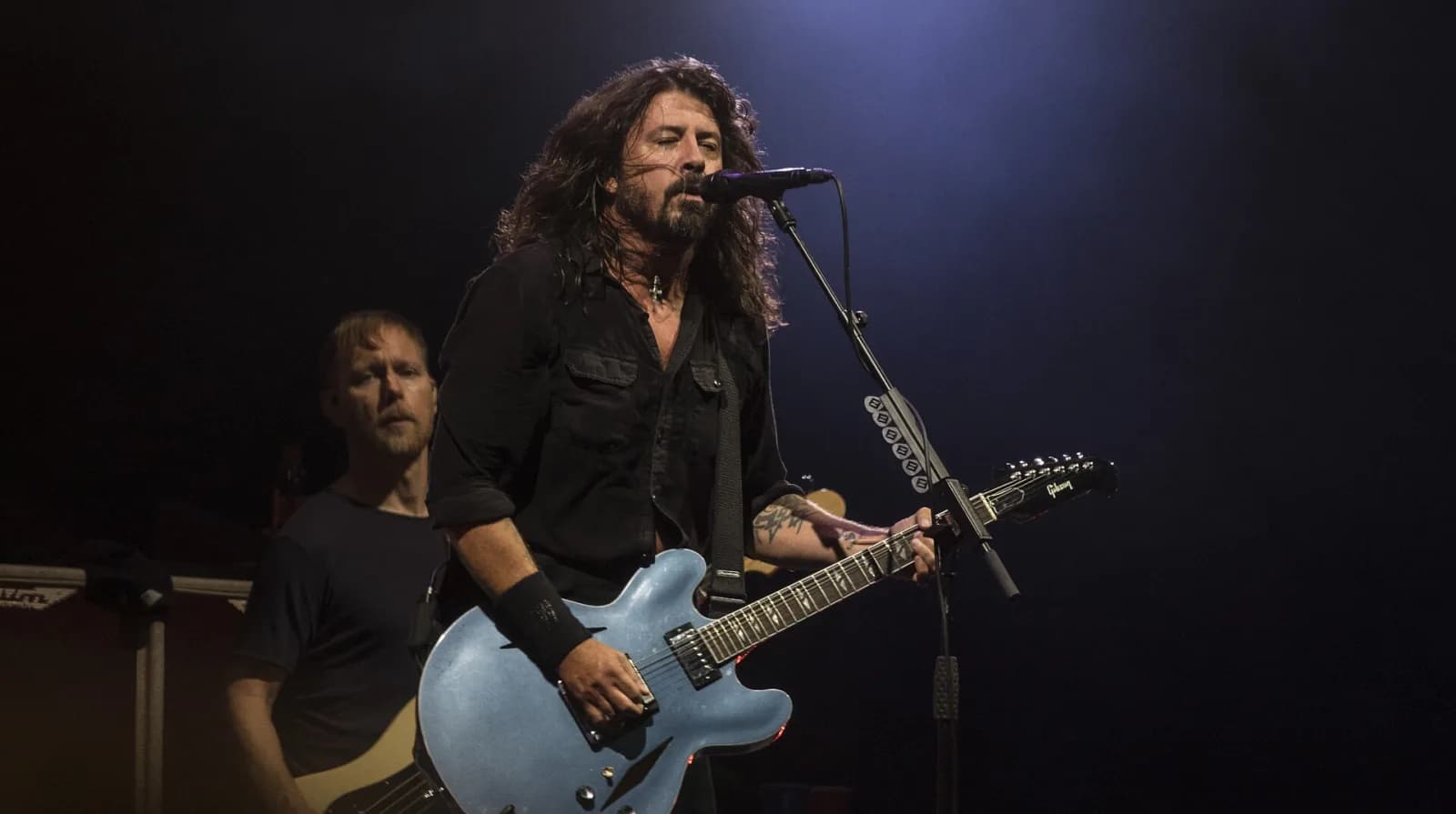 Foo Fighters performing at Lollapalooza Berlin in 2017, stage lit blue