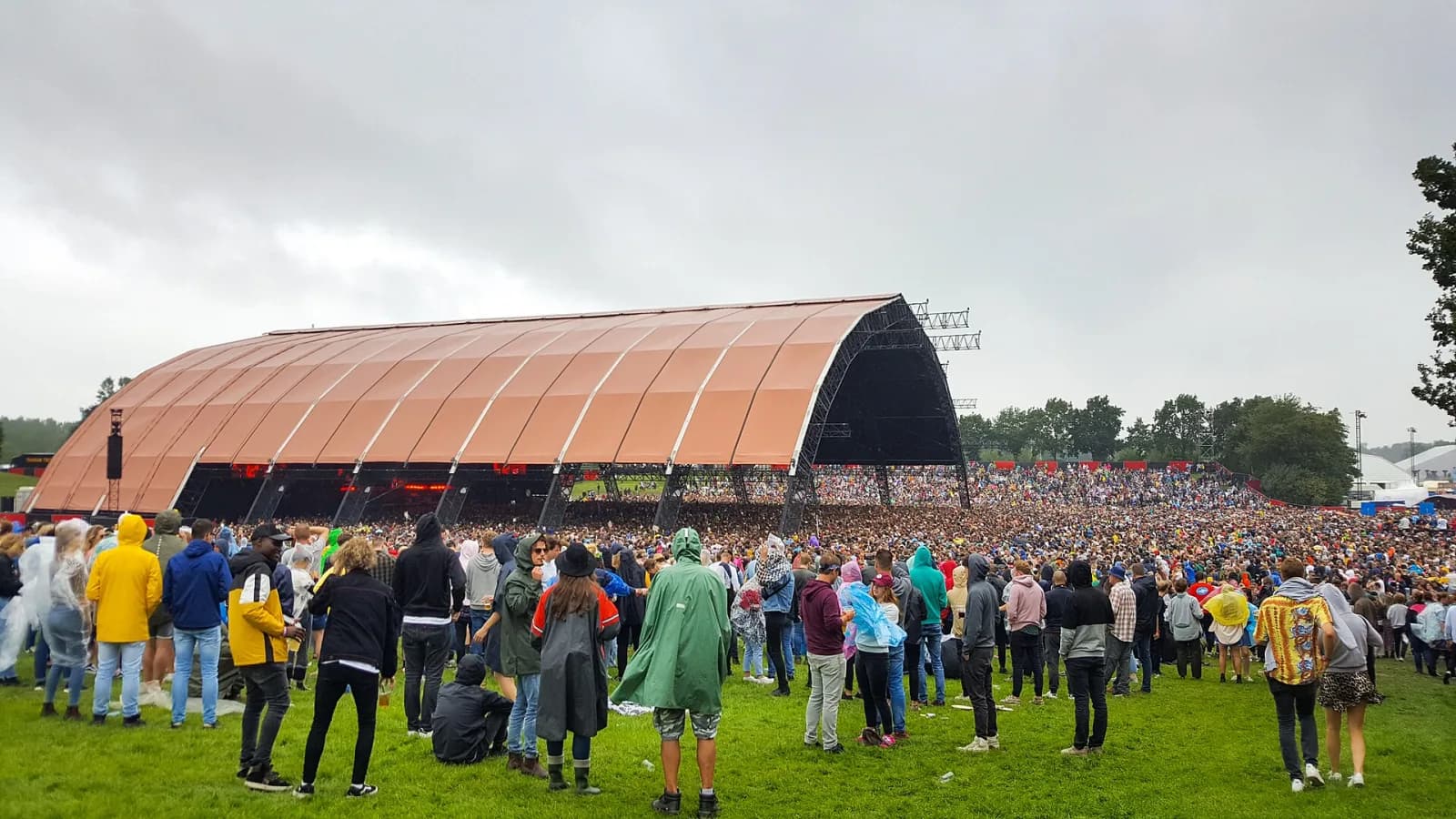 The giant Alpha main-stage tent at Lowlands with a full crowd stretching into the field