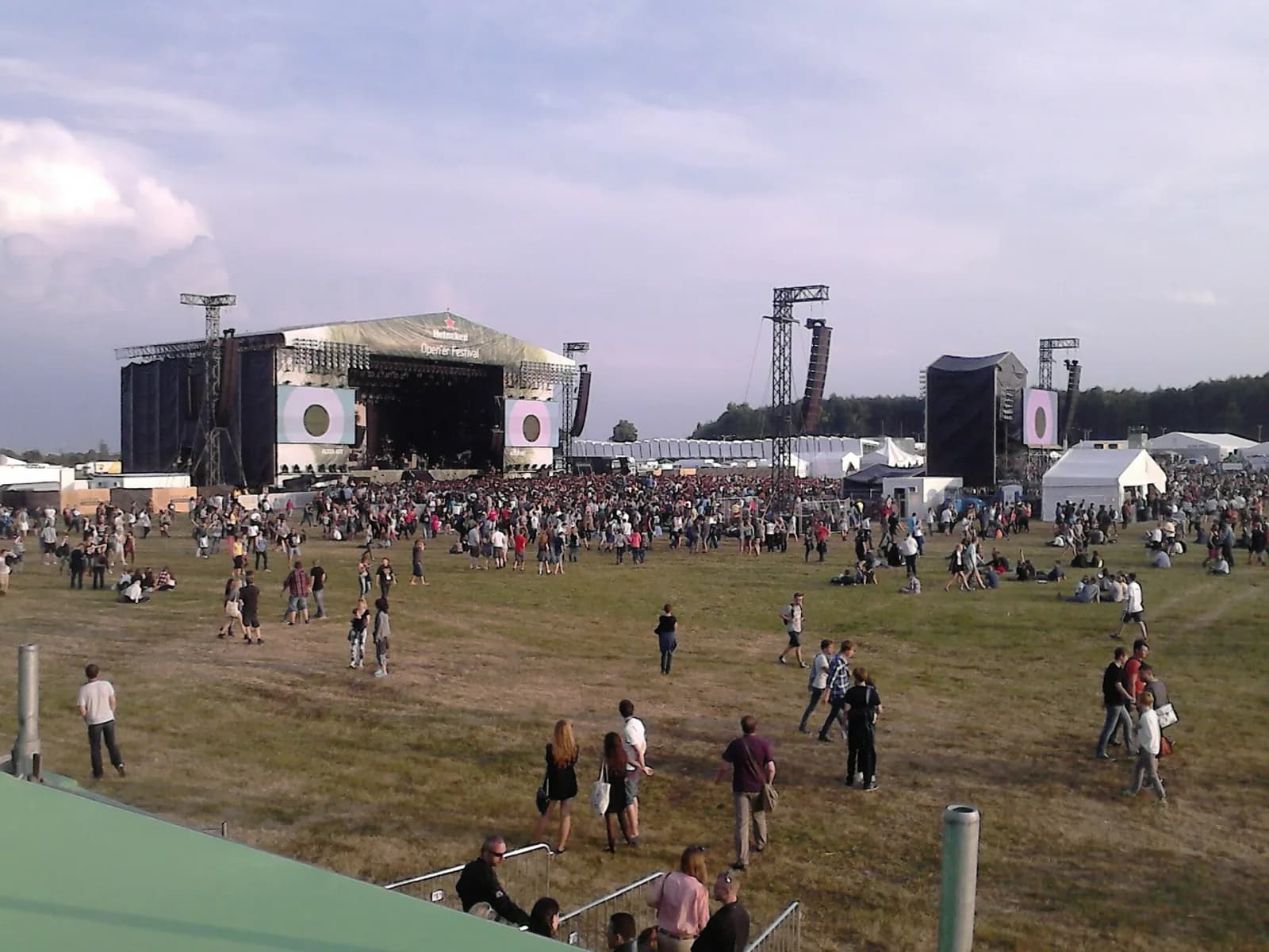 The Open'er main stage on the wide Gdynia-Kosakowo airfield with the crowd spread across the grass