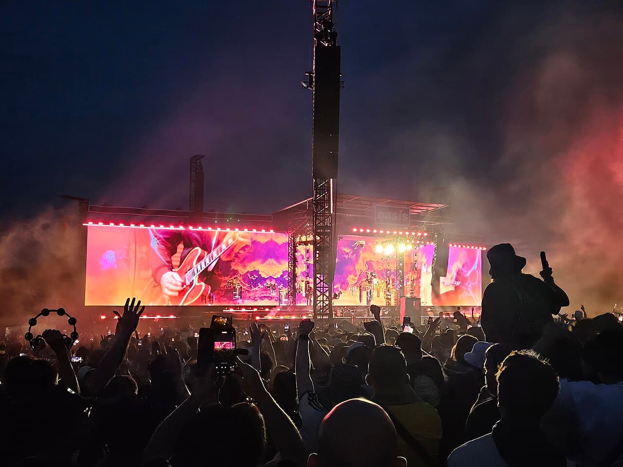 A large night-time concert crowd at Heaton Park